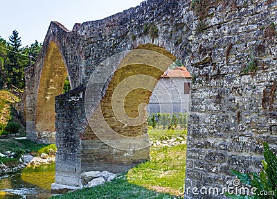 three archs medieval humpback bridge in Italy Stock Photo